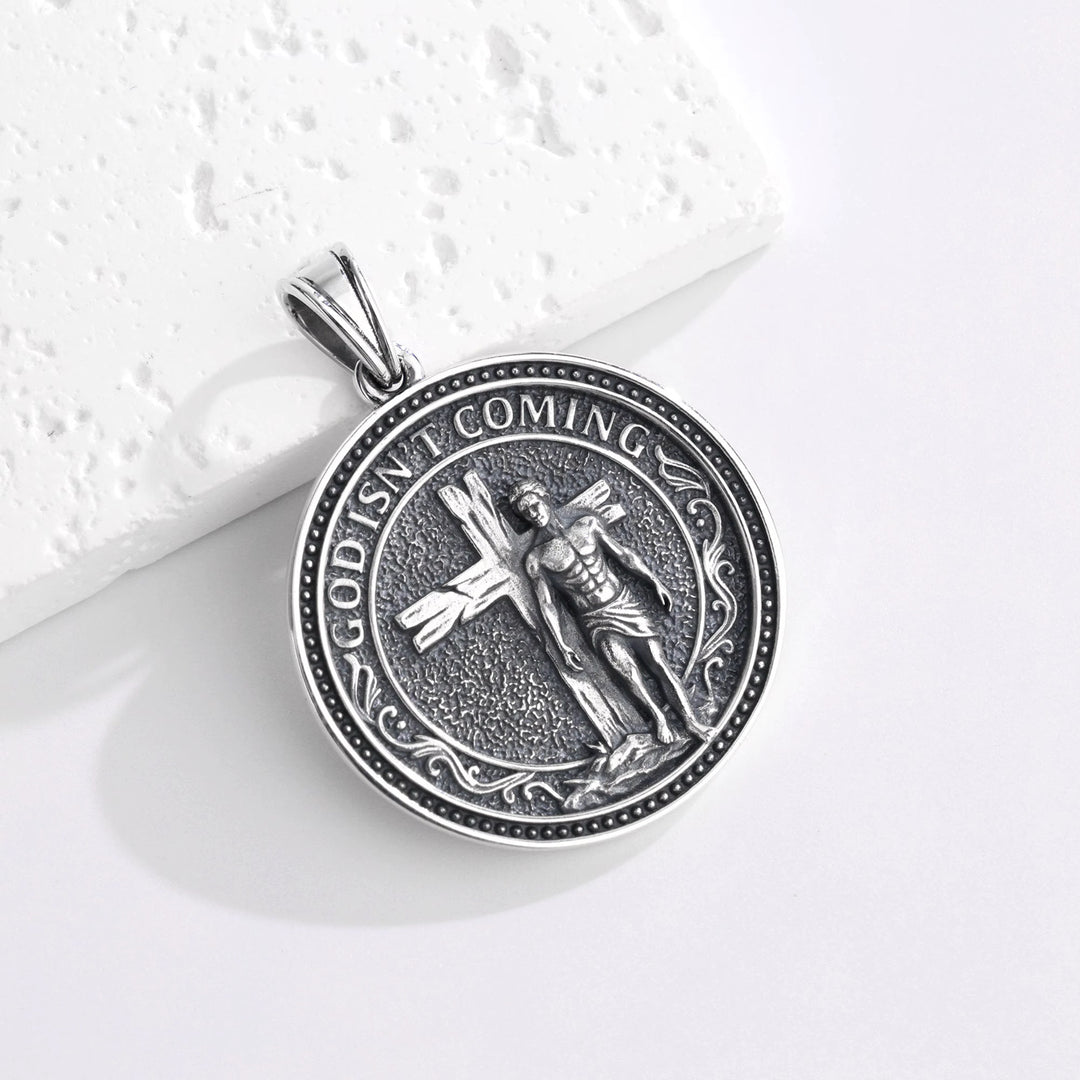 BLACK CLAW SELF-LIBERATION PENDANT 表面 GOD ISN'T COMING 十字架から歩き出す青年の立体彫刻